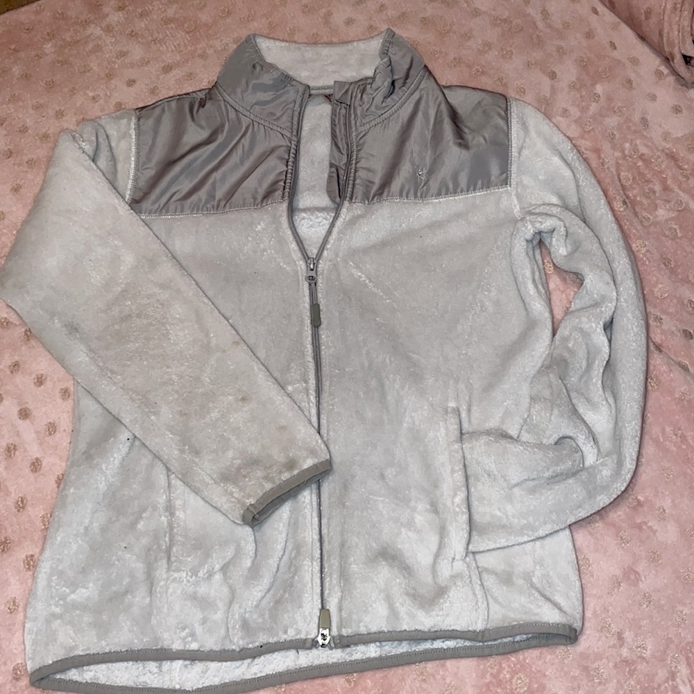 when it is washed do it with all whites and with a hit of bleach.